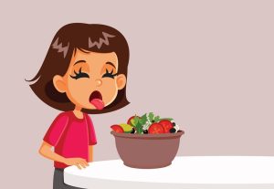 Unhappy Girl Avoiding Eating Salad - Eating disorder concept